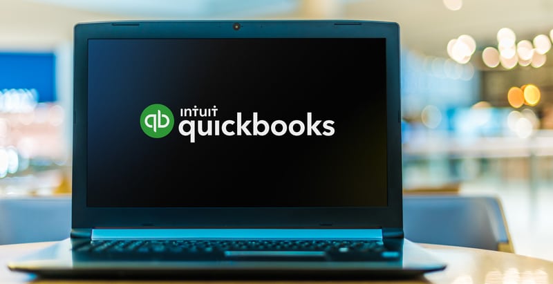 Laptop computer displaying logo of QuickBooks, an accounting software package developed and marketed by Intuit. QuickBooks Assistance by a QuickBooks ProAdvisor Brown, Chism & Thompson in Tulsa, OK.