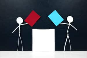 Stick man figure holding red and blue paper ballot beside a vote box. US presidential election democrat versus republican. Impact of the Presidential Election on Taxes.