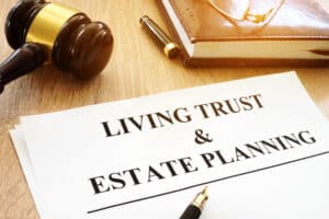 Living trust and estate planning form on a desk. estate taxes Oklahoma - Brown, Chism & Thompson